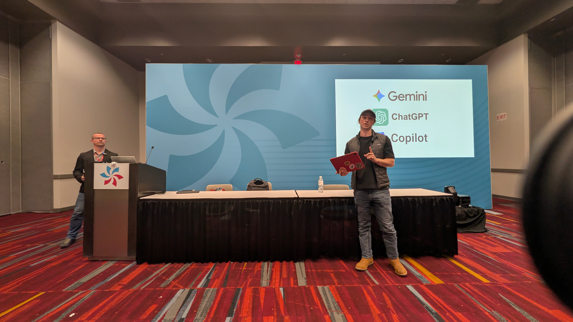 Carson giving an AHR Expo 2026 keynote on AI tools like Gemini, ChatGPT, and Copilot.