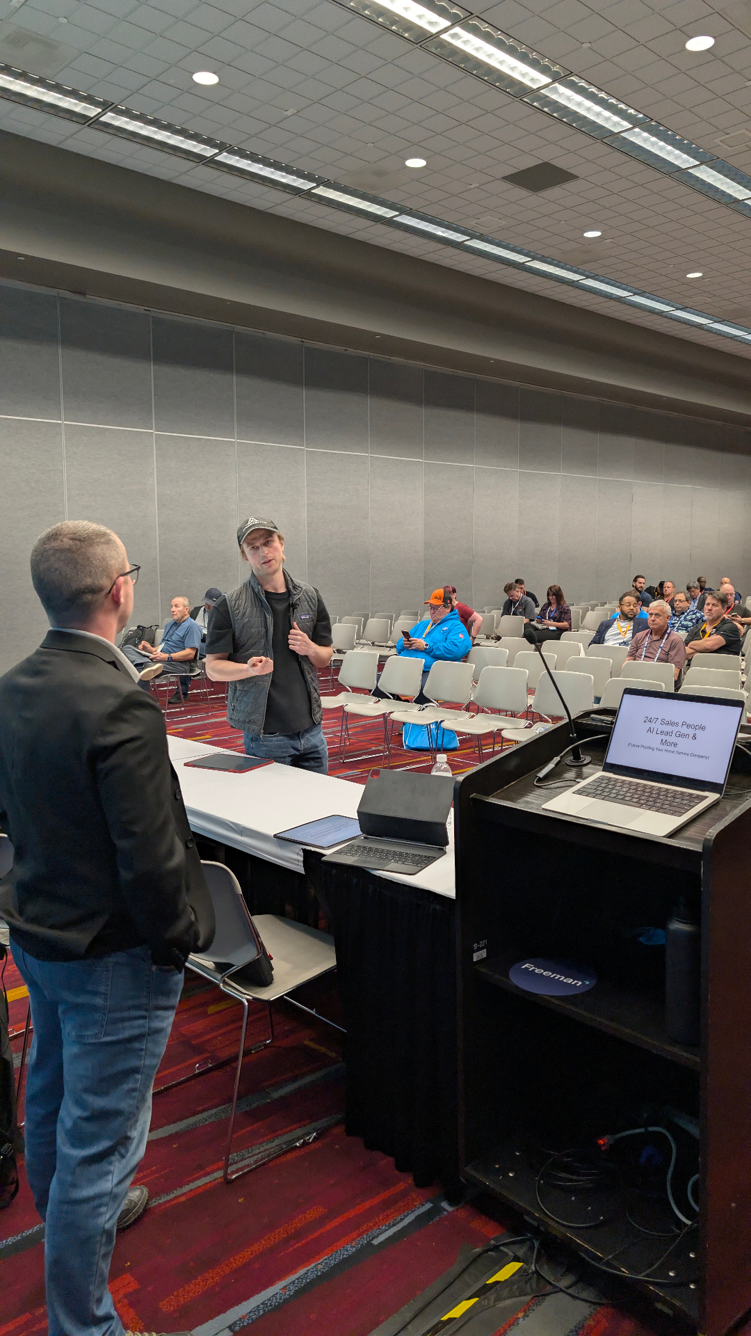Carson addressing a room during a live session